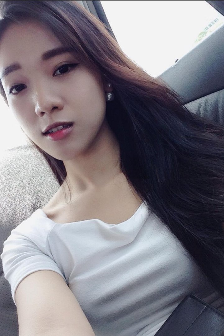 Woman in black holding a chihuahua by a pool table. Misa.